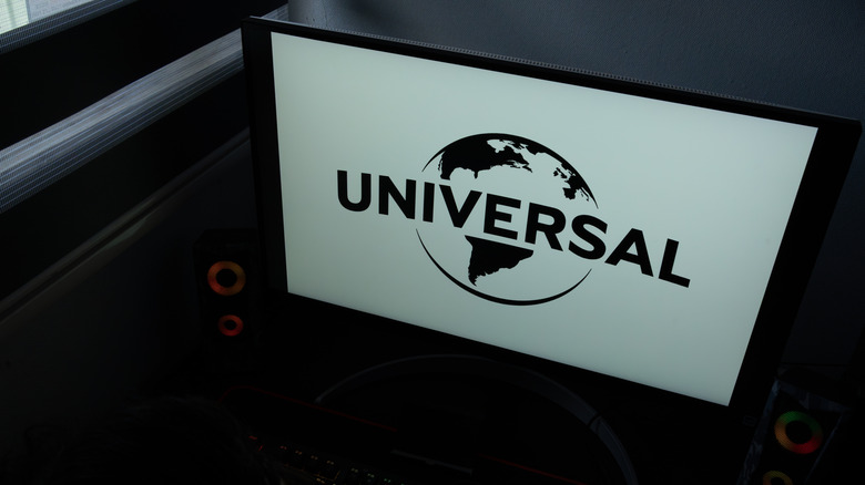 The Universal Pictures corporate logo and globe icon on a computer monitor