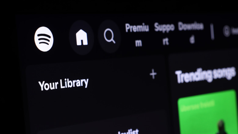 Spotify open on a large display, showing logo and Your Library options