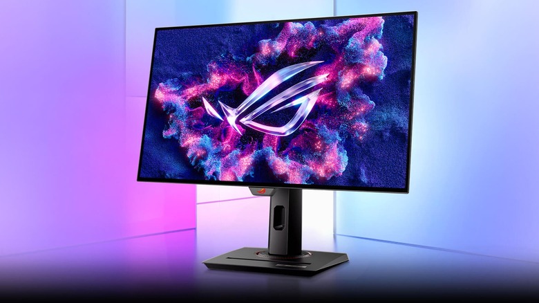 The ASUS ROG Strix 27-inch 1440P OLED Gaming Monitor displaying a color image as it sits in front of a blue and purple backdrop