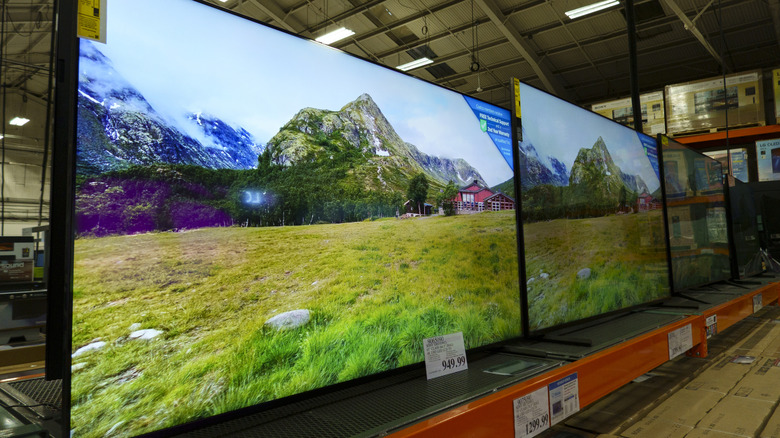 Large-screen Sony TVs in a row at Costco.