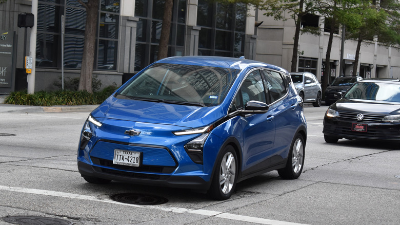 Blue Chevy Bolt stopped in traffic