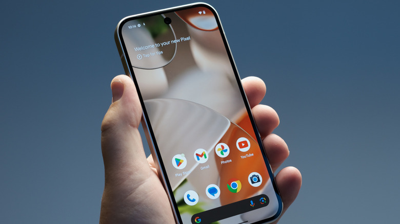 A person holding the Google Pixel 9