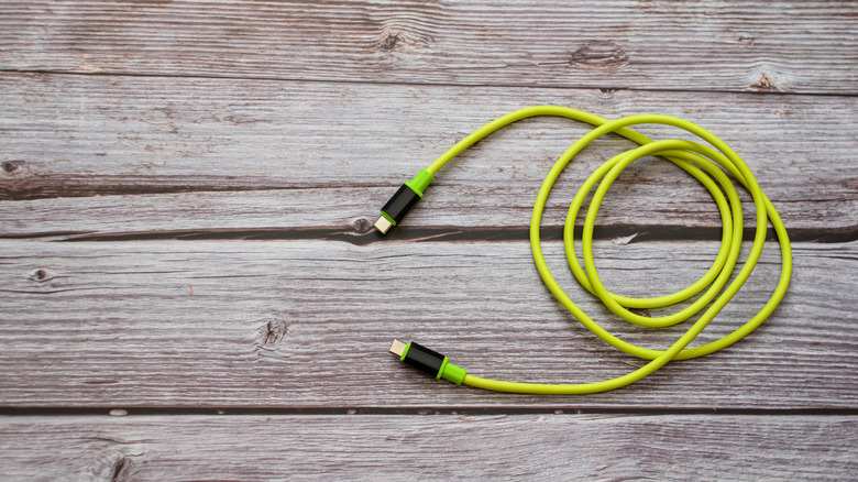 A USB-C cable on a wooden background