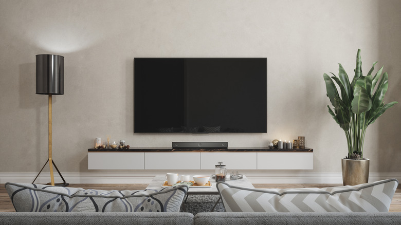 A wall-mounted TV in a modern living room