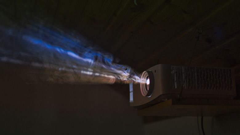 A projector projecting an image through smoke