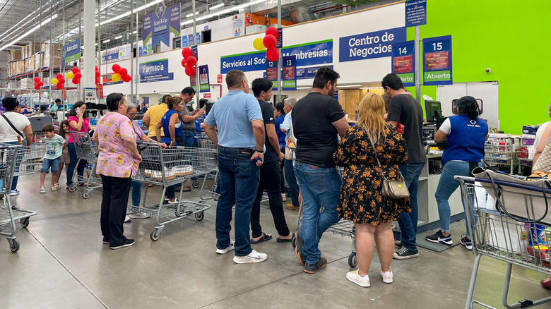 Many people in line to check out in a Sam's Club in Mexico