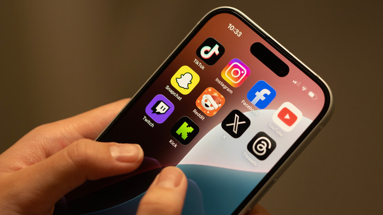 Close-Up of person's hands using iPhone