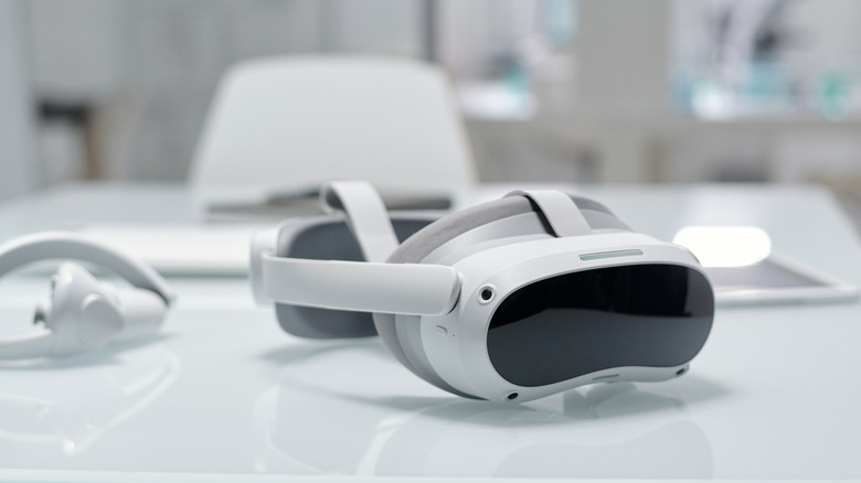 A VR headset siting on white desk