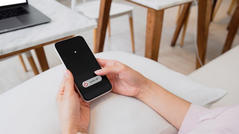 Person powering phone off