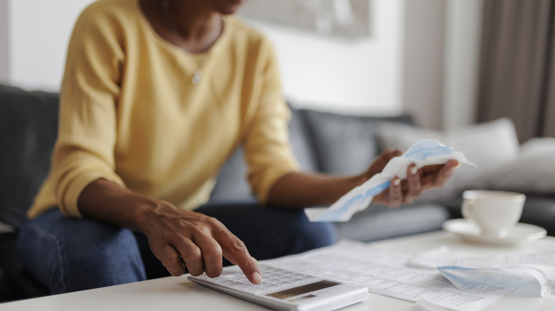 A person reviewing a bill