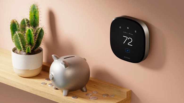 The Ecobee Smart Thermostat Premium on a wall next to a shelf