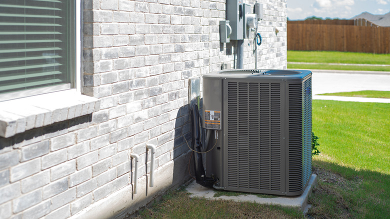 Air conditioner along the side of a modern house