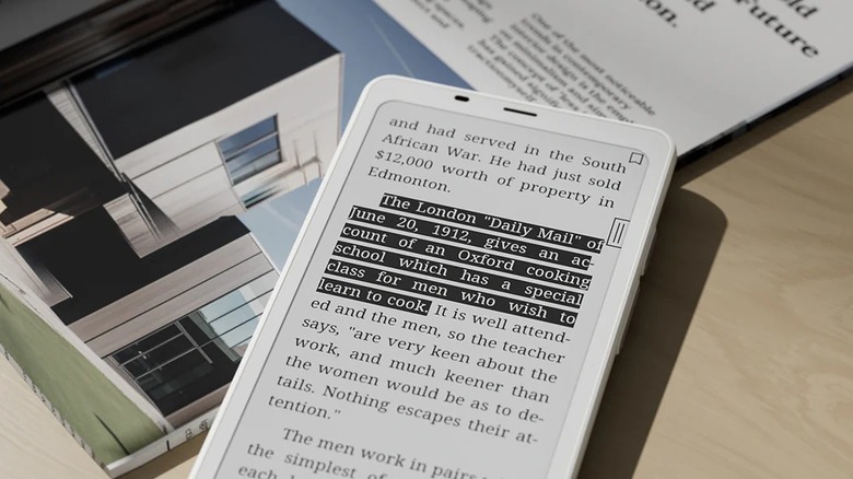 Boox Palma 2 on table showing the highlighted section in a book