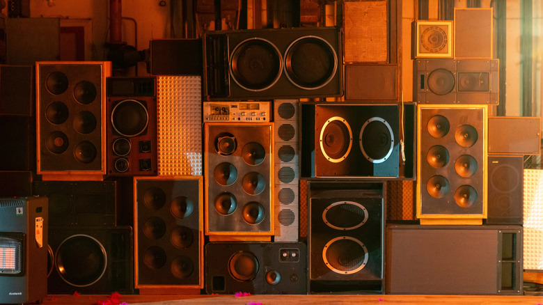 Various speakers stacked on top of one another