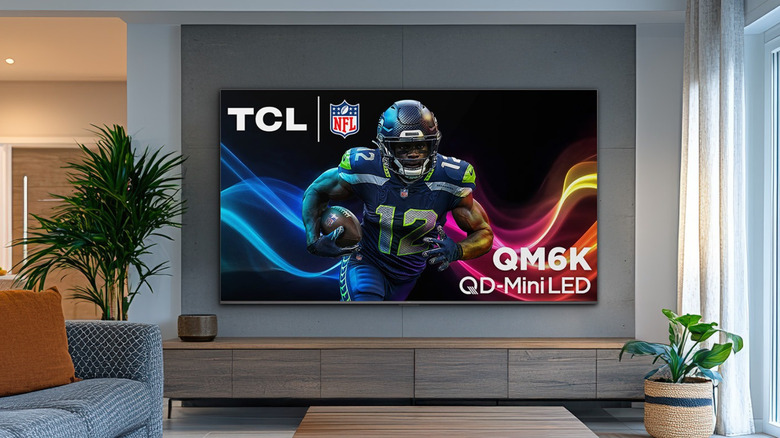 TCL TV displayed in living room showing NFL player