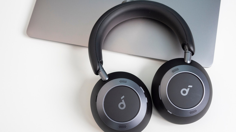 Soundcore headphones on a laptop on a desk