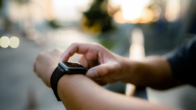 Close-up of smartwatch on man's wrist