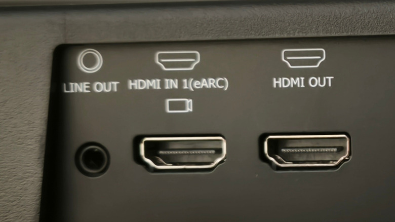 Zoomed in image of an HDMI eARC port, HDMI standard output, and 3.5mm aux out on the back of a soundbar.