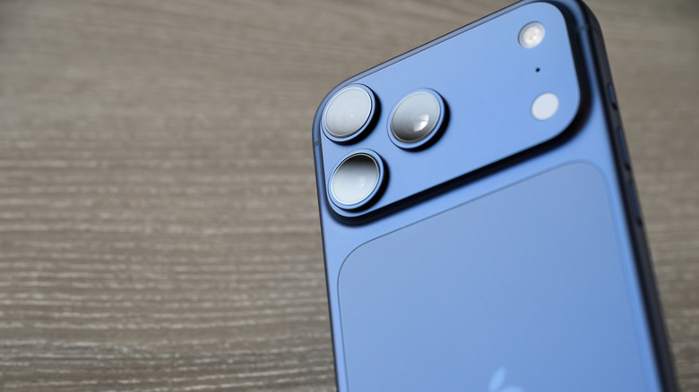 A photograph of the iPhone 17 against a wooden surface.