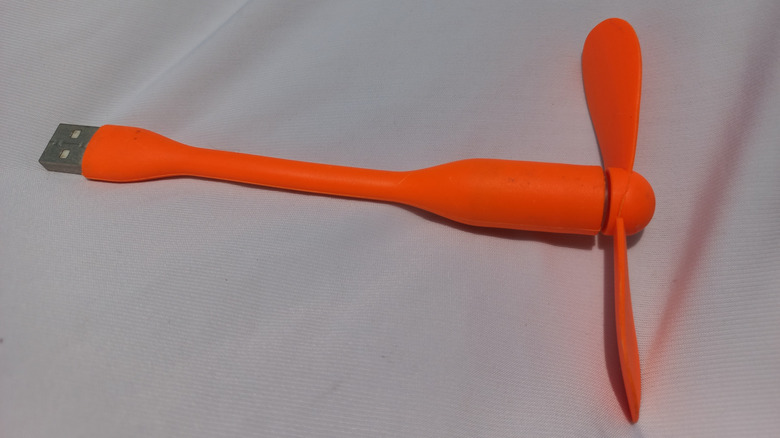 A USB-powered fan on a desk