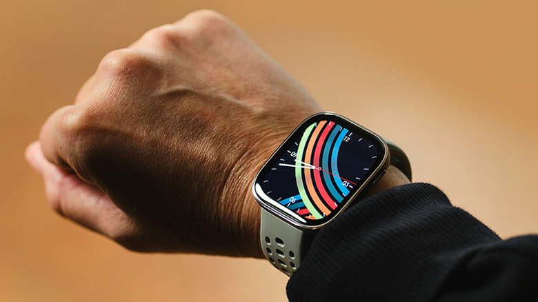 A mans's wrist with the Amazfit Bip 6.