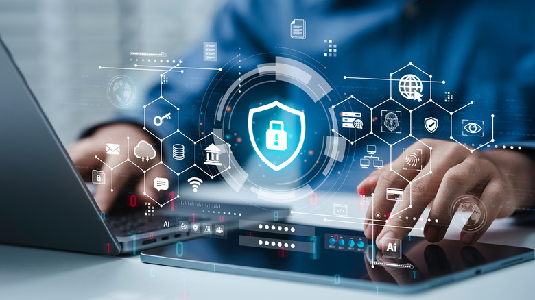 Person typing on computer with lock graphic suggesting idea of security