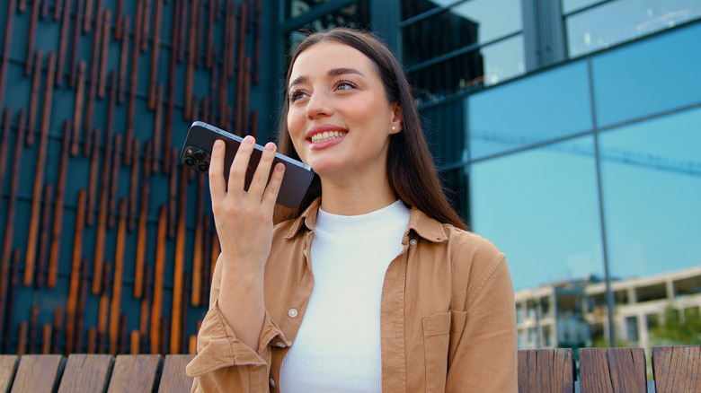 Young woman speaking to phone