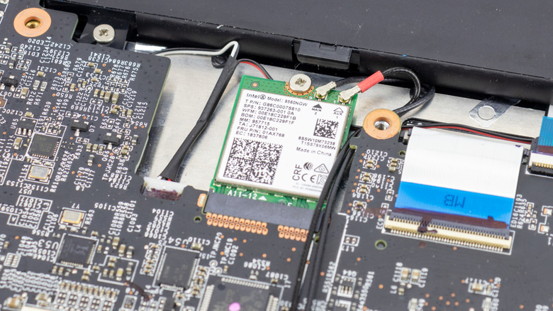 Interior of a disassembled gaming laptop with an Intel Wi-Fi Card