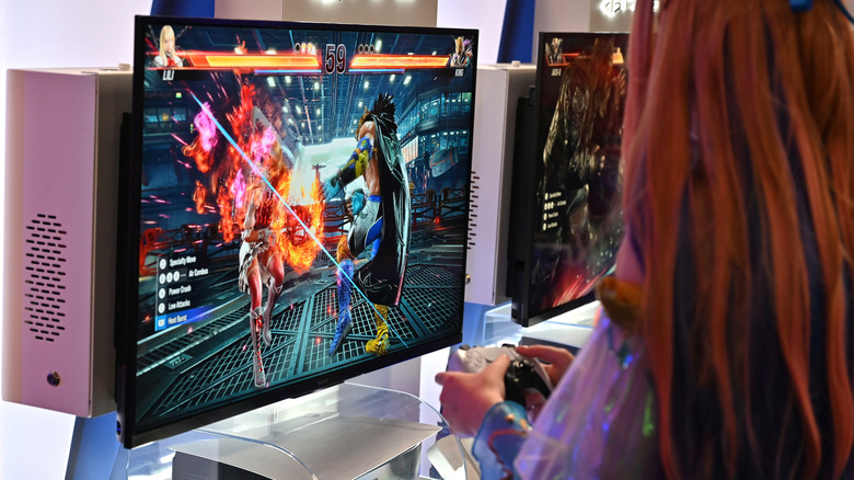 Gamers play Tekken 8 on PlayStation 5 (PS5) at an event
