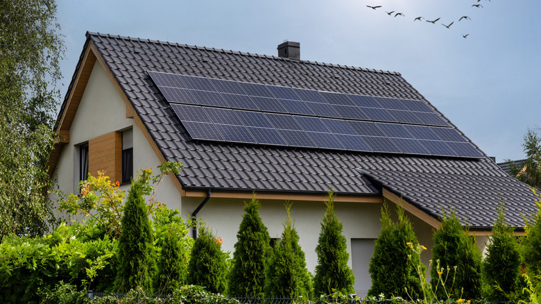 A modern home with solar panels on the roof