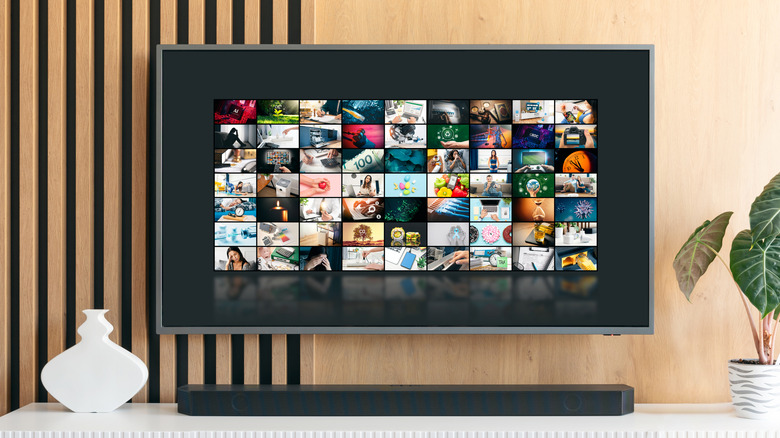 A smart TV and sound bar on a media console in a home