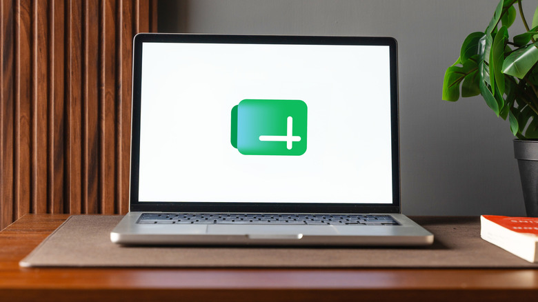 Google Sheets logo displayed on a laptop's screen