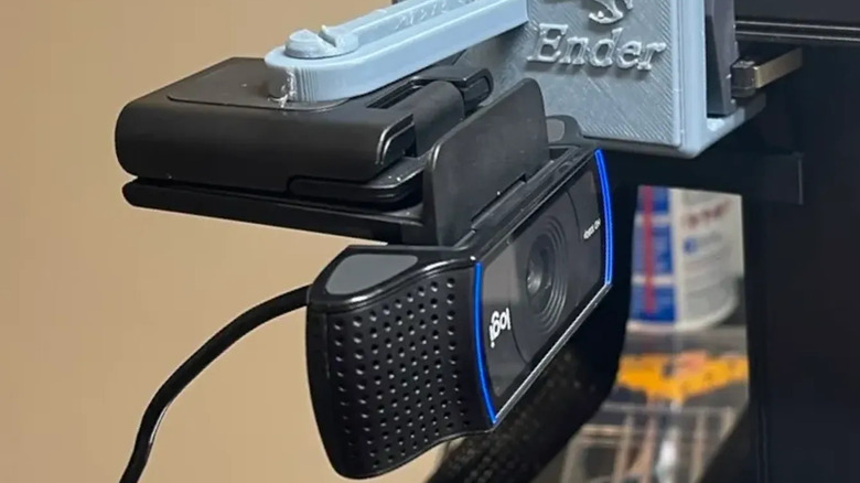Webcam attached to a 3D printed camera mount on an Ender 3D printer.