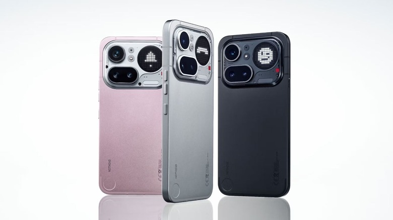 three Nothing Phone 4a Pro shown in three colors standing up to reveal the back