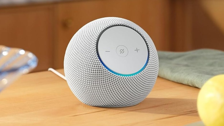 The Amazon Echo Dot Max placed on a wooden table.