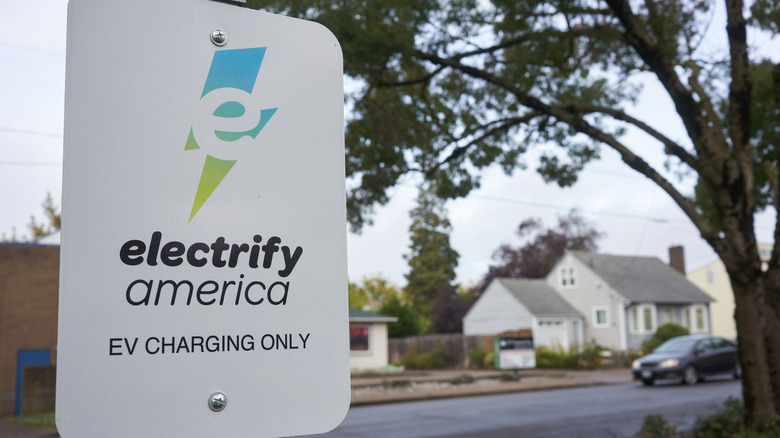 An Electrify America sign in a neighborhood
