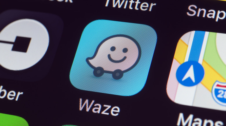The Waze app icon on a display