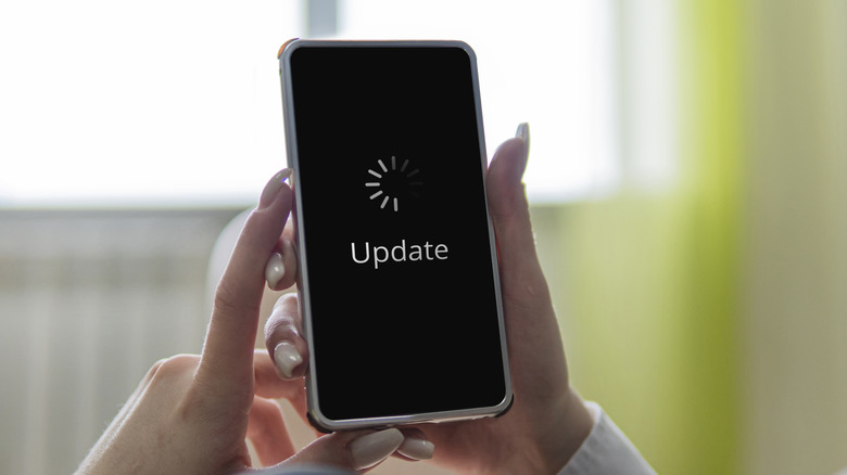 A smartphone with "update" written on its screen