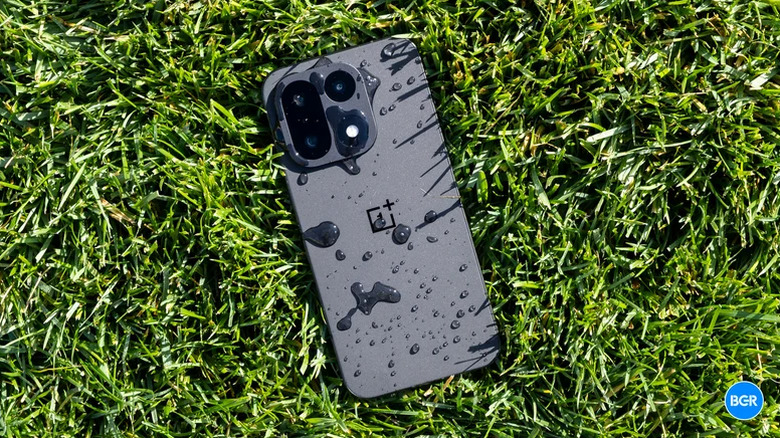 OnePlus 15 smartphone placed on grass