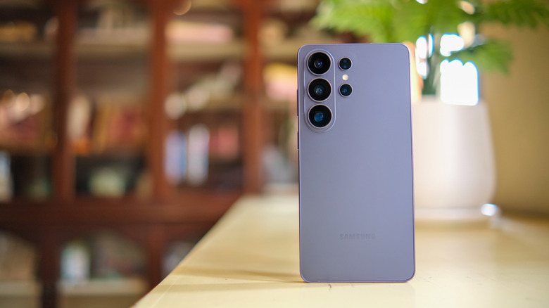 The Samsung Galaxy S26 Ultra rear view with camera lenses visible, resting on a shelf