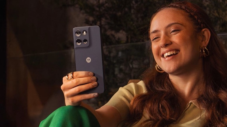 Woman using the Motorola Moto G 2026 smartphone