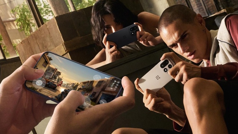 Several people using the OnePlus 15 to play games on the go