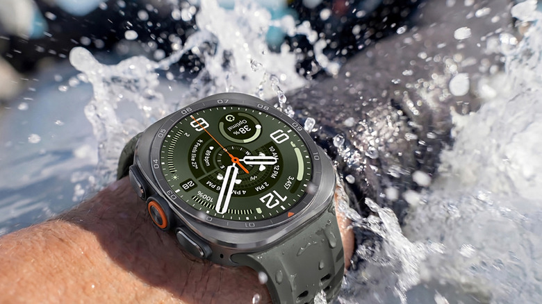 An arm in splashing water wearing the Samsung Galaxy Watch Ultra 2.