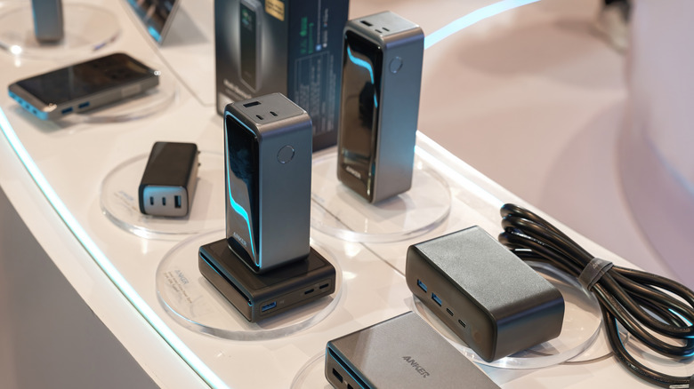 Several Anker chargers on display at a tech event.