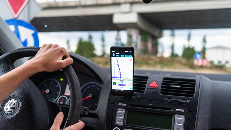 person driving using apple maps