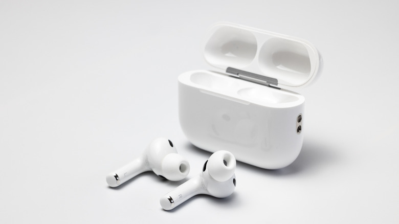 AirPods Pro 3 next to a charging case