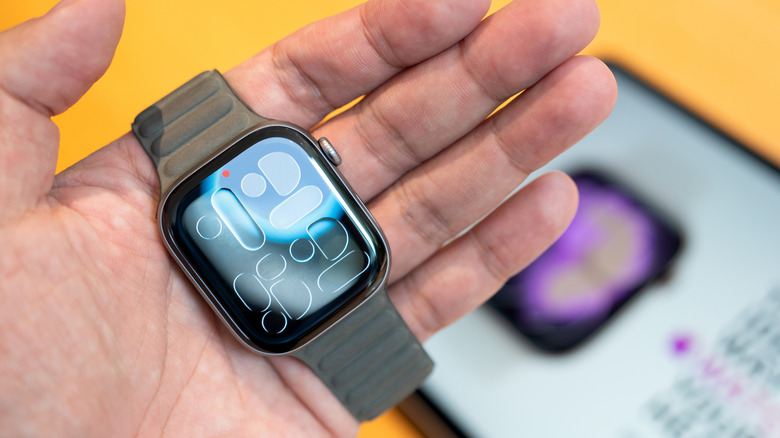 Person holding an Apple Watch Series 11