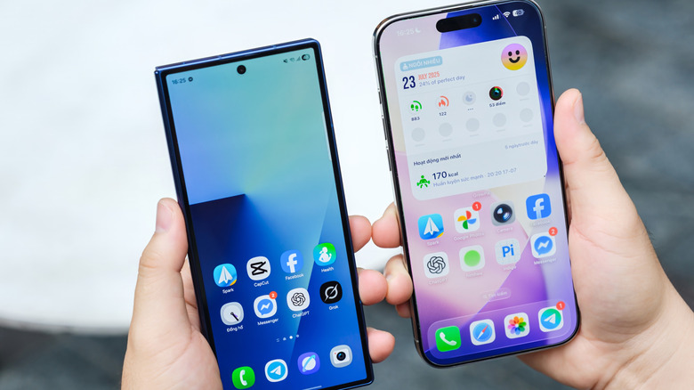 A Galaxy Z Fold 7 and an iPhone held in both hands