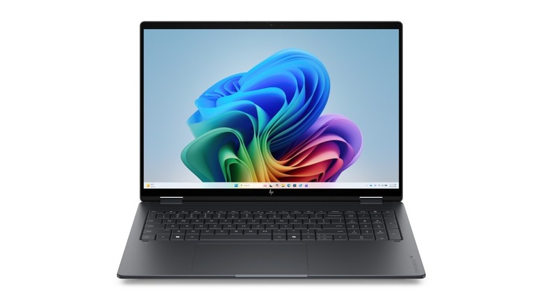 HP OmniBook X Flip 16 2-in-1 laptop showing the Windows 11 wallpaper.