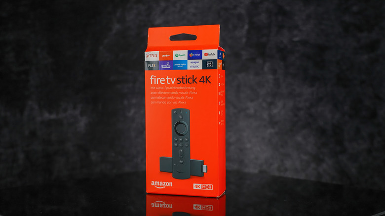 The Amazon Fire TV Stick 4K product box, set against a gray backdrop.